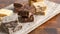 An Assortment of Various Flavors of Fudge on a Wood Butcher Block