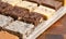 An Assortment of Various Flavors of Fudge on a Wood Butcher Block