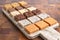 An Assortment of Various Flavors of Fudge on a Wood Butcher Block