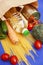 An assortment of vegetables and other foods purchased at a supermarket in a recyclable brown paper bag on a blue background