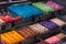 Assortment of vibrant French macarons on display in a bakery window