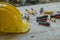 assortment of well-used hand tools spread out on a worn wooden surface, indicative of a workspace or a workbench