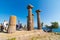 Assos ancient city with tourists. Ruins of Temple of Athena