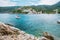 Assos cute town, on Kefalonia island, Greece. View of beautiful bay with sail yacht boat and mountains in background