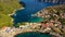 Assos village in Kefalonia, Greece. Turquoise colored bay in Mediterranean sea with beautiful colorful houses in Assos village in