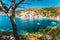 Assos village, Kefalonia Island Greece. Turquoise cove with transparent water of Mediterranean sea. Surrounded by green