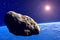 Asteroid. Giant asteroid cruising near Planet Earth scenery or spacescape. Outer space landscape and astronomy 3D