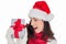 Astonished brunette in santa hat showing gift