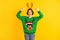 Astonished crazy girl deer green x-mas sweater point finger reindeer headband receive gift present theme costume party