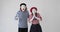 Astonished mime artist couple celebrating success