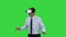 Astonished young businessman wearing VR glasses Concept of the future technology on a Green Screen, Chroma Key.