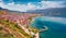 Astonishing spring cityscape of Pogradec town. Impressive outdoor scene of Ohrid lake