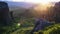 Astonishing view of Meteora valley at sunset, rays running across rocks and over Rousanou nunnery and St Nicholas Anapausas monast