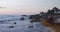 Astonishing view of sargassum on beach under beautiful sunset sky