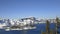 Astonishing view of snowy mountain range and lake under blue sky