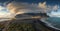 Astonishingly beautiful scenery of the sandy beach and the sea with breathtaking clouds in the sky