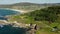 Astounding View Of A Tranquil Beach In Arteixo On A Sunny Day. aerial