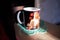 Astrakhan, Russia - 2020.05.25: A mug with a picture of Kurt Cobain stands in a sunbeam