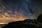 Astro night sky, Milky way galaxy stars over the Alps, stormy sky, Mars planet beyond the clouds, snowcapped mountain range