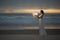Astrology. Secret and riddle. Beautiful attractive girl on a night beach with sand hugs the moon, art photo