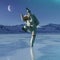 Astronaut in another planet is dancing on the ice lake