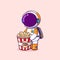 The astronaut is buying a popcorn in a theater and ready to eat it while watching