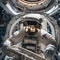 An astronaut conducting a spacewalk while repairing a critical component of a space telescope2