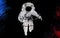 Astronaut isolated on a black background. Dust splash in space style