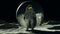Astronaut man on the Moon in a Space Suit Standing with a Gold Visor and a Big Floating Silver Alien Sphere Front View
