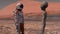 Astronaut meets a Martian on Mars. First contact. Alien on Mars. Exploring mission to mars. Colonization and space exploration