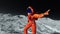 Astronaut in orange exo suit exploring and dancing around