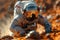 An astronaut in racing gear crawls on Martian soil with arthropodlike helmet