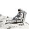 an astronaut relaxing on the lunar surface with his feet up