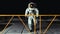 Astronaut walking on a platform on the moon.