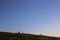 Astronomical observatories on a mountain hill in the evening at sunset with a clear starry sky