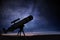 Astronomy and stars observing concept. Silhouette of telescope and starry night sky in background
