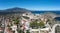 Astros, Arcadia, Peloponnese, Greece. Aerial drone panoramic view of village, castle, sea, blue sky
