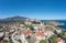 Astros, Arcadia, Peloponnese, Greece. Aerial drone panoramic view of village, castle, sea, blue sky