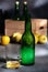 Asturian cider and apples on black background.