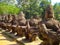 Asura demon statues by road at Angkor complex