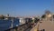 Aswan, Egypt - November 2021: Beautiful felucca boats on Nile river passing by Aswan, Egypt.