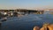 Aswan, Egypt - November 2021: Beautiful felucca boats on Nile river passing by Aswan, Egypt.