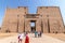 Aswan, Egypt - September 13, 2018: Tourists visiting the Edfu Temple. Dedicated to the Falcon God Horus, Located on the west bank