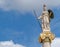 Athena marble statue the ancient Greek goddess of knowledge and wisdom under a blue sky with clouds, some space for text.