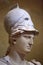 Athena wearing a Corinthian helmet with a laurel branch. Roman marble statue, close-up