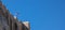 Athens, Greece, Acropolis rock, Greek flag waving on clear blue sky, banner