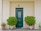 Athens Greece, cosy house entrance with green door and plants