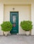 Athens Greece, cosy house entrance with green door and plants