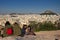 Athens, Greece, January 30 2018: People enjoy the view to the city of Athens from the hill of Areopagus