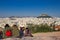 Athens, Greece, January 30 2018: People enjoy the view to the city of Athens from the hill of Areopagus